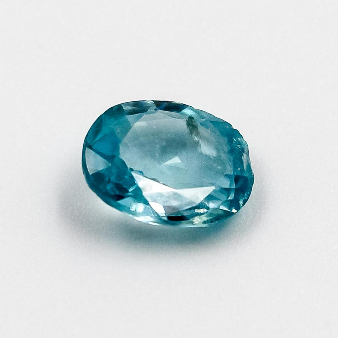 Beautiful Certified 1.40 Ct Natural Blie Zircon: Beautiful Certified 1.40 Ct Natural Blie Zircon.This Cambodia Mined Zircon is an oval cut measuring 7.51 x 6.38 x 2.66 mm.