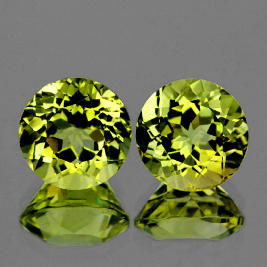 Natural Green Gold Lemon Quartz Pair 12.00 MM - VVS: Natural Lemon Quartz; WEIGHT : 13.34 cts; SHAPE : Round; SIZE ( L x W x D ) : 12.00 mm; QUANTITY : 2 pieces (Perfectly Matched Pair) COLOR : Top Green Gold; CLARITY : Flawless-VVS1; ORIGIN : Brazil; H