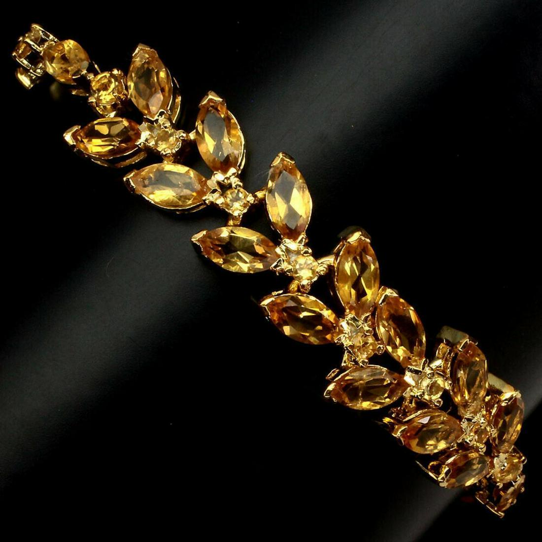 Natural 8x4mm Yellow Citrine 71.41 Ct Bracelet: 925 STERLING SILVER;PLATE....14K YELLOW GOLD;LENGTH (INCHES)8;MAIN STONECITRINE;TOTAL WEIGHT71.41 CT (TOTAL WEIGHT OF SILVER + STONE)DIMENSION* STONE 2.5 TO 8.0 X 4.0 MM. * FACE BRACELET 185.0 X 12.0 