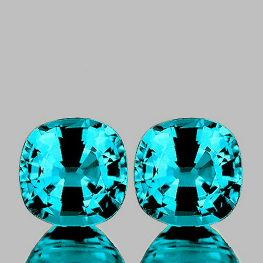 NATURAL PREMIUM INTENSE BLUE ZIRCON PAIR - FL: Natural Zircon (Earthly Mined)SIZE ( L x W x D ) : 5.50 mmCOLOR : Intense Blue Premium ColorSHAPE : CushionQUANTITY : 2 pieces (Perfectly Matched Pair)LUSTER : Excellent! CLARITY : FLAWLESS-VVS1 HARDN