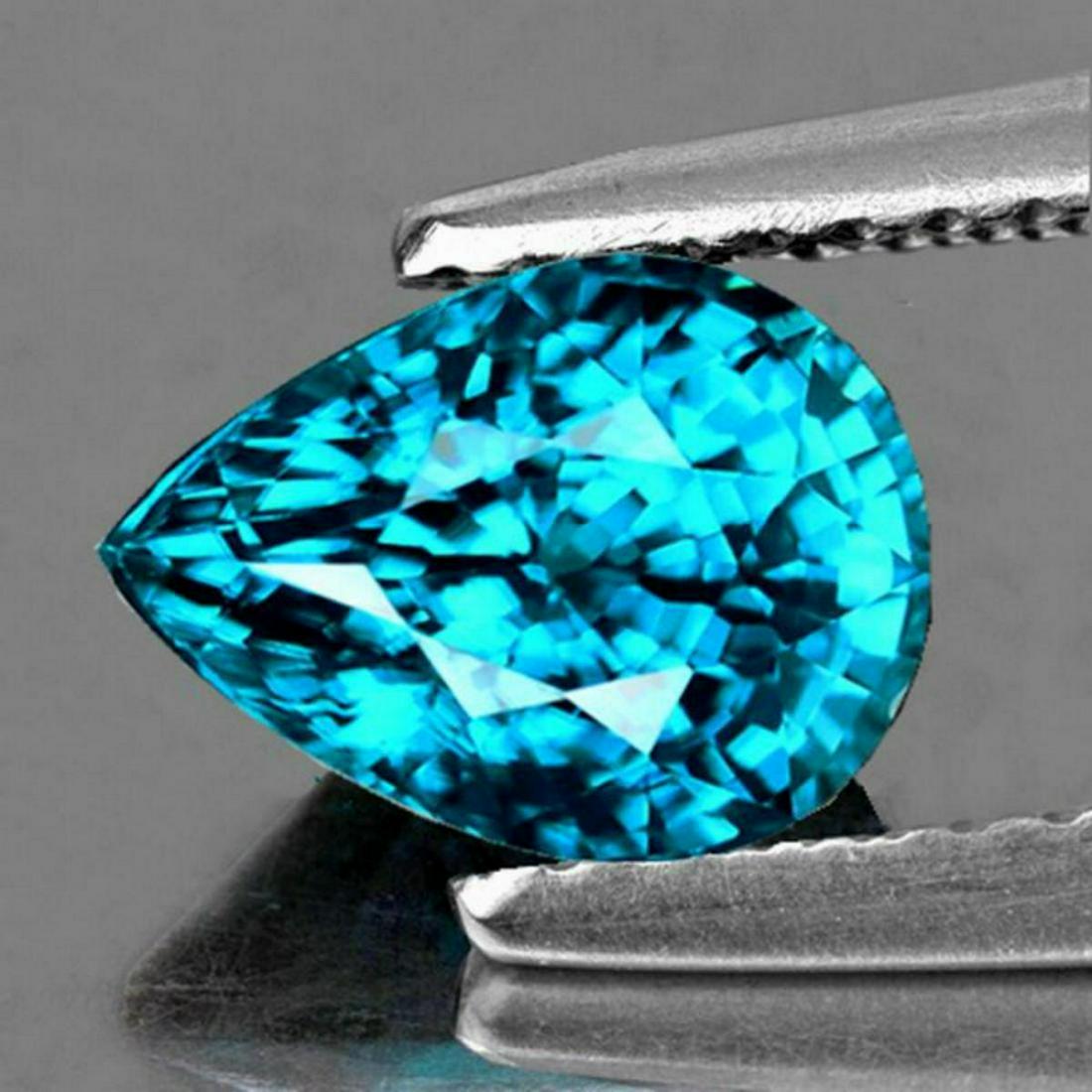 NATURAL PREMIUM ELECTRIC BLUE ZIRCON 5.85 Ct - FLawless: WEIGHT : 5.85 cts;STONE NAME : Natural Zircon (Earthly Mined)SIZE ( L x W x D ) : 11.30 x 7.79 x 7.09 mm;COLOR : Electric Blue Top Color;SHAPE : Pear;QUANTITY : 1 piece;LUSTER : Extreme Brilliancy;CLA