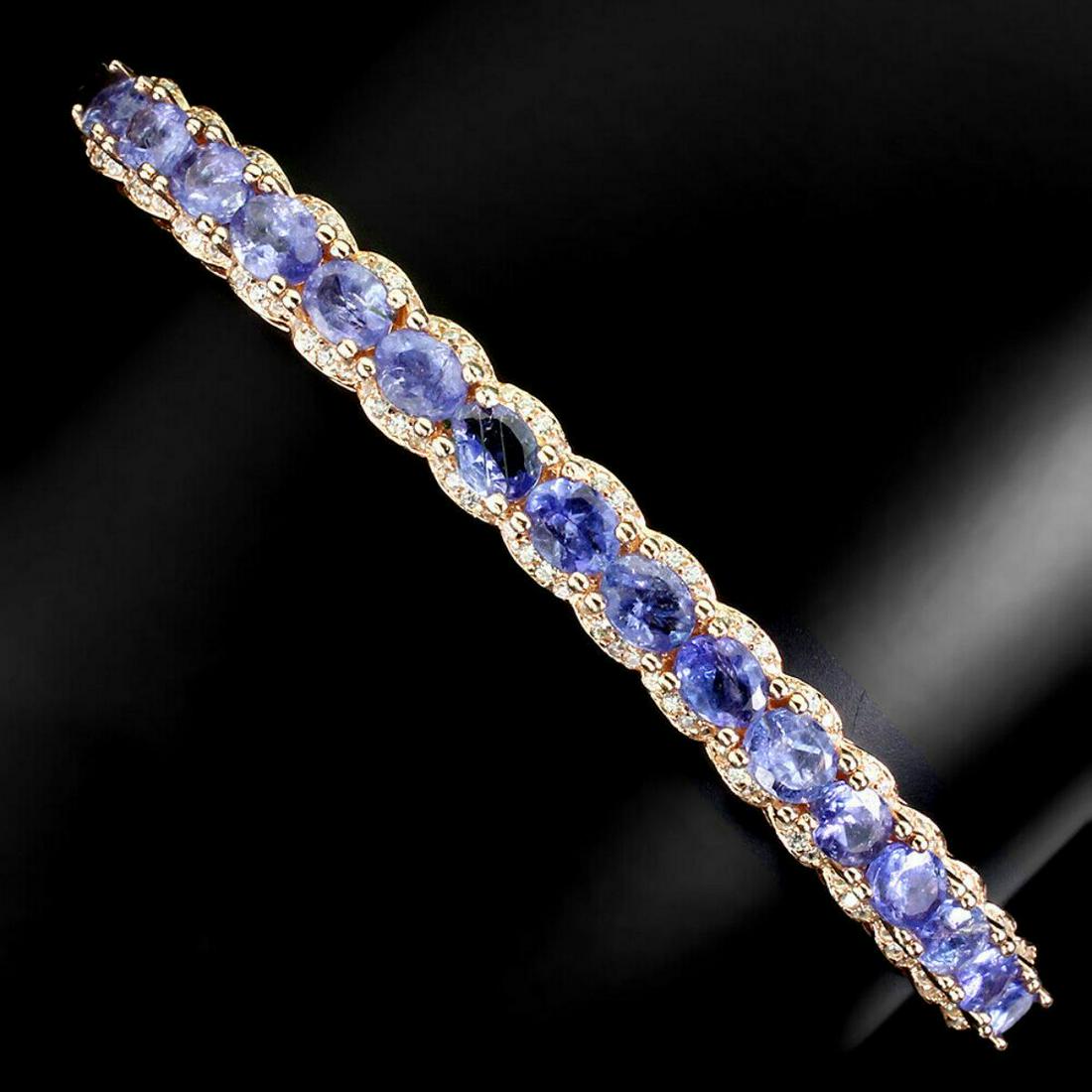 Natural Stunning Oval Tanzanite Bangle: 925 STERLING SILVER;PLATE-14K ROSE GOLD;MAIN STONE-TANZANITE;TOTAL WEIGHT-15.52 GRAM (TOTAL WEIGHT OF SILVER + STONE)DIMENSION-* STONE 5.0 X 4.0 MM. * CZ 1.0 MM. * DIAMETER 2.6 X 2.1 INCHES. * FACE BA