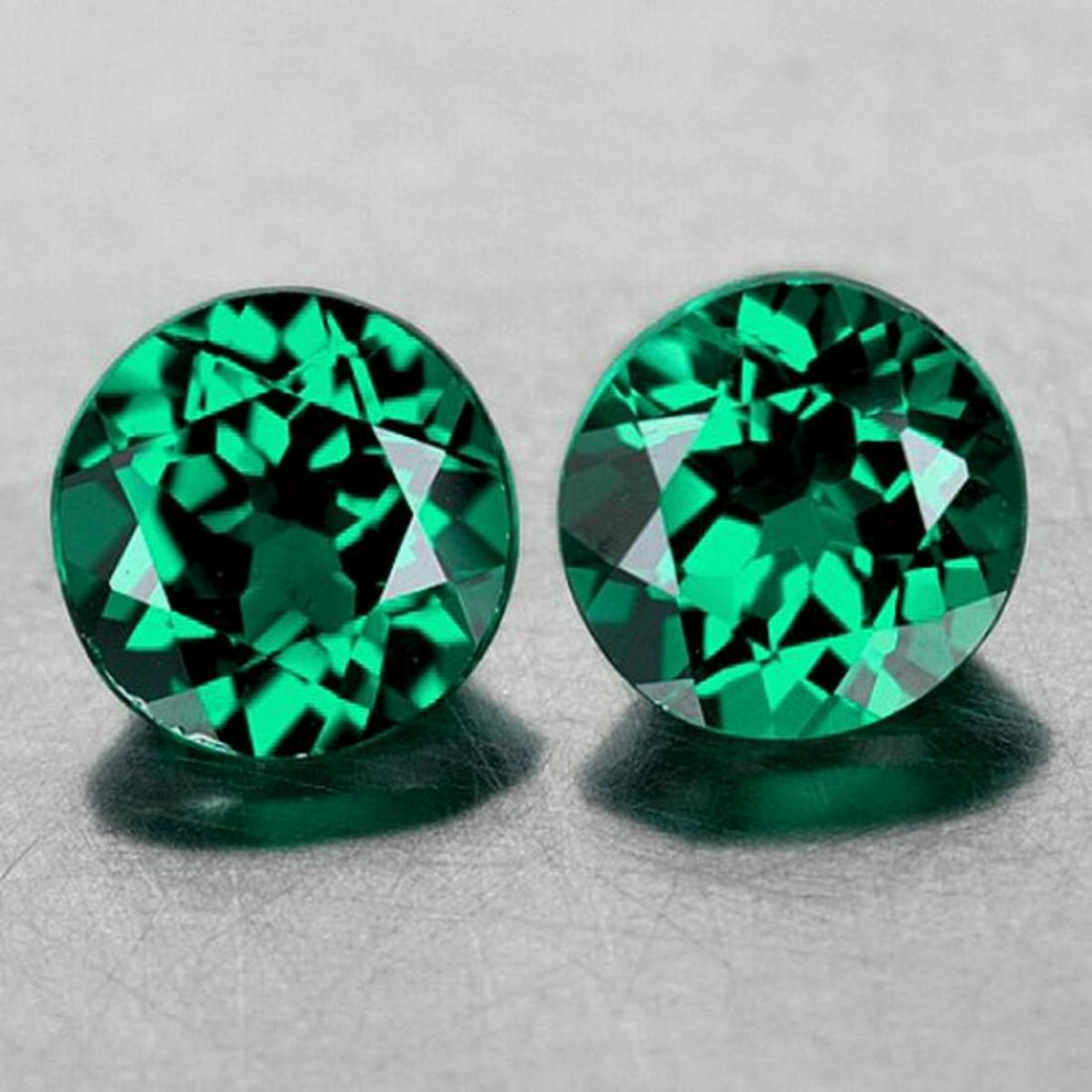 Natural Emerald Green Mystic Topaz Pair [Flawless-VVS]: Natural Mystic TopazSIZE ( L x W x D ) : 7.00 mm;COLOR : Emerald Green;SHAPE : Round;QUANTITY : 2 pieces ;LUSTER : Excellent!CLARITY : FLAWLESS-VVS1 ; BEST QUALITYHARDNESS : 8;ORIGIN : Brazil; TREATME