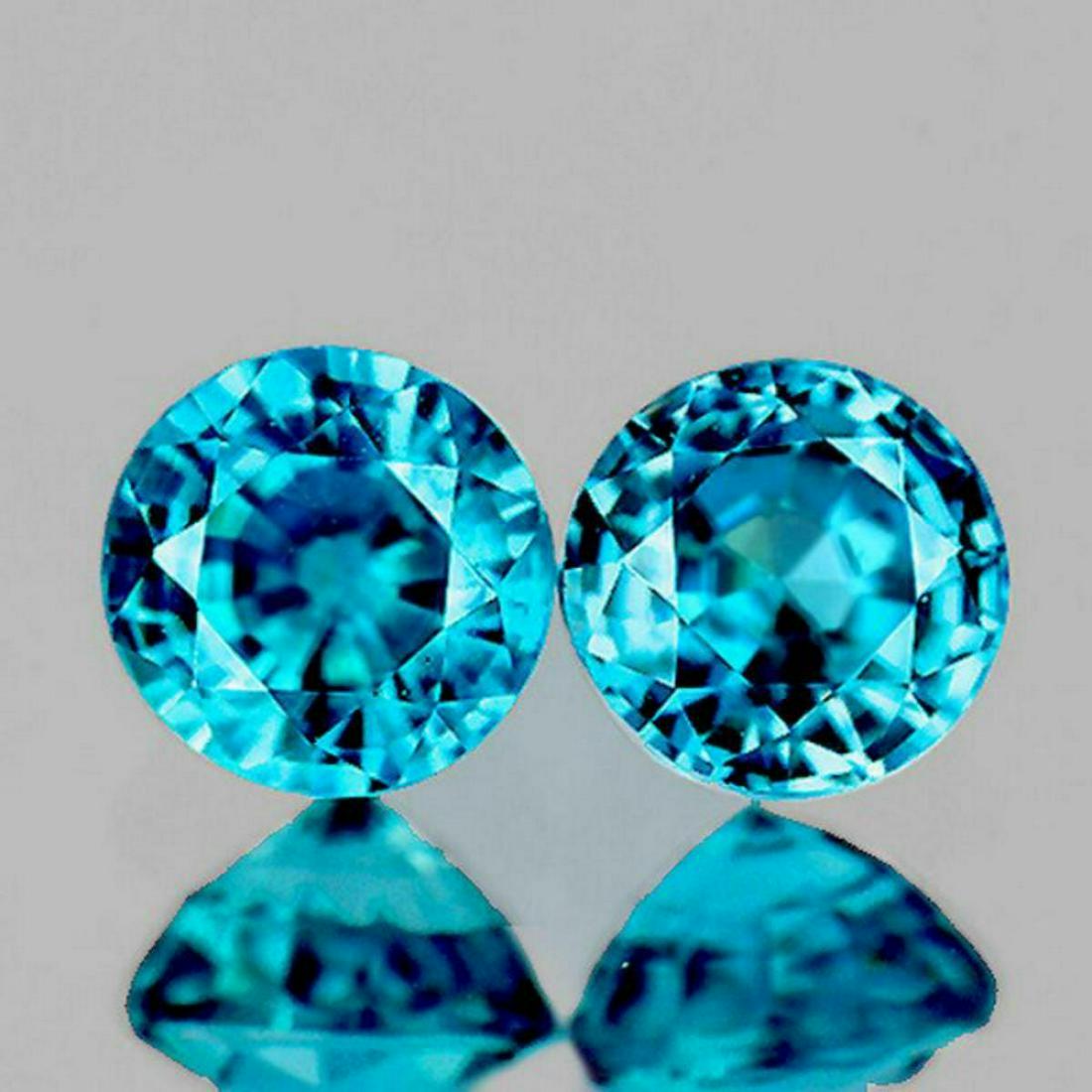 Natural Extreme Brilliancy Blue Zircon Pair [If-VVS]: WEIGHT : 2.40 cts;STONE NAME : Natural Zircon (Earthly Mined);SIZE ( L x W x D ) : 6.00 mm;COLOR : Intense Blue;SHAPE : Round (Step Cut)QUANTITY : 2 pieces;LUSTER : Extreme Brilliancy;CLARITY : FLAWLE
