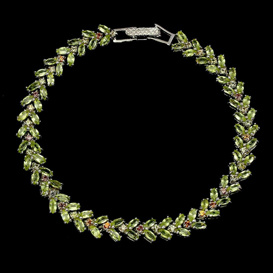Natural Marquise Peridot & Sapphire Bracelet: 925 STERLING SILVER;PLATE-14K WHITE GOLD;LENGTH (INCHES)8;MAIN STONE-PERIDOT;OTHER GEMS-SAPPHIRE;TOTAL WEIGHT-13.94 GRAM (TOTAL WEIGHT OF SILVER + STONE)DIMENSION-* STONE 1.5 TO 4.0 X 2.0 MM. * TOTAL 