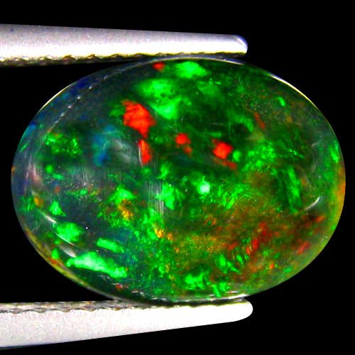 Natural Multi Color Welo Black Opal 2.80 Carats: RAINBOW MULTI FLASHINGShape:OVALWeight:2.80 CtsSize:(LxWxH)12.41 x 9.01 x 5.31 mmHardness:6.5 MOH'S SCALEOrigin:WELO-ETHIOPIA