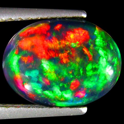 Natural Multi Color Welo Black Opal 2.03 Carats: RAINBOW MULTI FLASHINGShape:OVALWeight:2.03 CtsSize:(LxWxH)10.84 x 8.18 x 4.29 mmHardness:6.5 MOH'S SCALEOrigin:WELO-ETHIOPIA