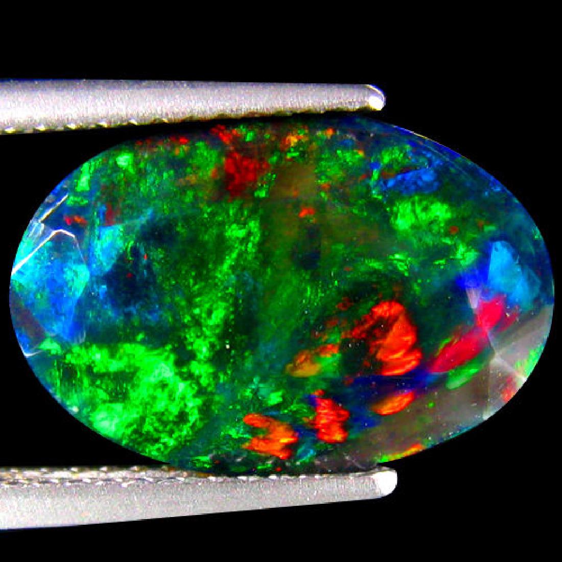 Natural Multi Color Welo Black Opal 4.53 Carats: RAINBOW MULTI FLASHINGShape:OVALWeight:4.53 CtsSize:(LxWxH)15.28 x 10.34 x 7.30 mmHardness:6.5 MOH'S SCALEOrigin:WELO-ETHIOPIA