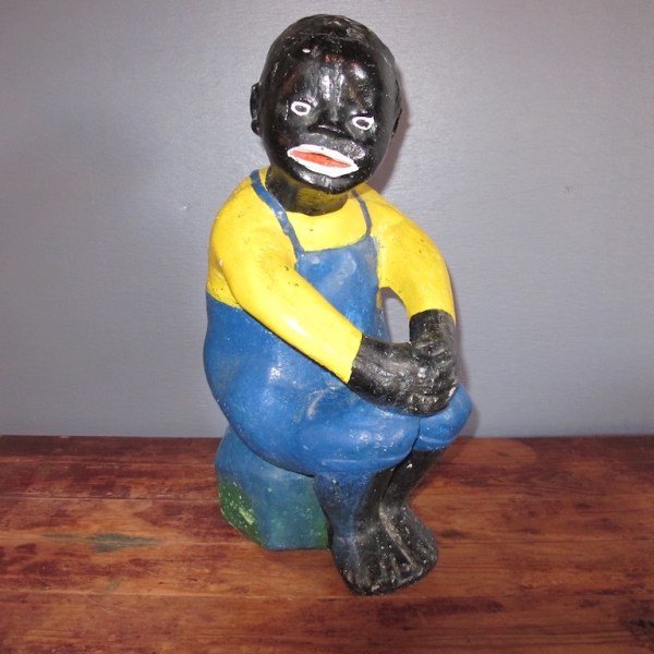 42. 40s Black Americana Cement Statue: This Black Americana stone cast statue of a boy on a stump was created sometime in the forties. He was fishing until he lost he lost his pole. That last nibble was a big one! A whimsical garden statue