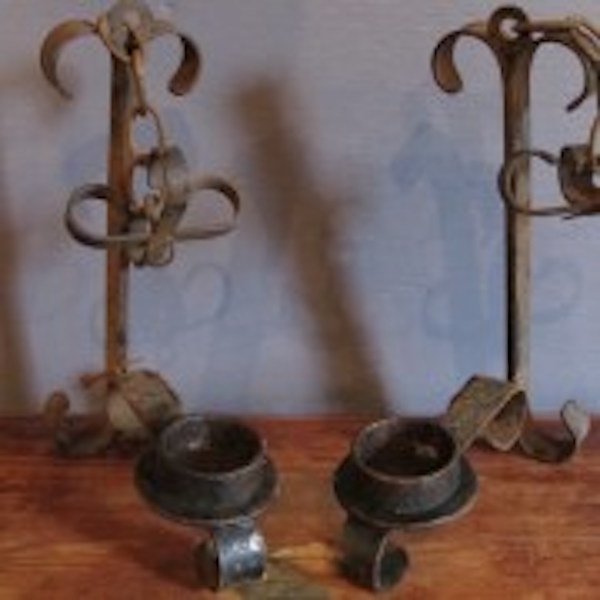 100. 3 Pc. Old World Gothic Wall Sconces: This iron Old World Gothic set consists of a three arm centerpiece sconce and two matching single arm sconces. Dimensions: The three arm piece measures 13.5"w with a 12" arm projection and is 19" 