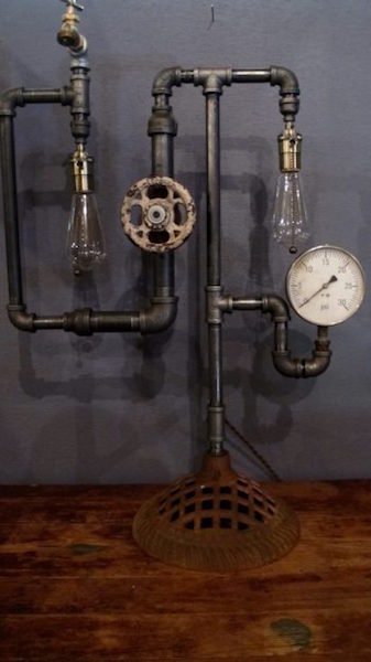 191. Steampunk Table Lamp: Gauge, Valve Cock, Pipes, Spigot and Edison Style Bulbs form this outstanding industrial\factory\machine age table lamp. A one of a kind, artist rendered piece. 2 bulb. Dimensions: 22"w x 31" h.