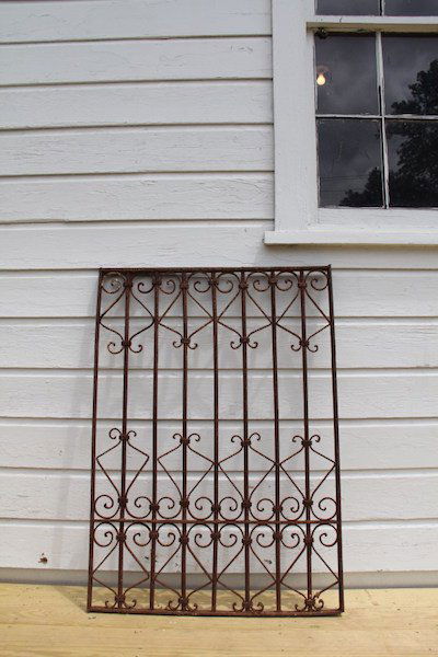 338. Wrought Iron Gate: Early 20C cast iron gate or commanding window guard.
