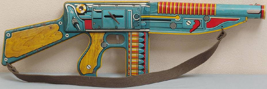 Vintage 1940s Tin Toy Machine Gun by Unique Art: This is an original vintage circa 1940s tin toy machine gun made by Unique Art Mfg. Co, Inc. 25" long and 7 1/2" high. Unique Art Manufacturing Company was an American toy company, founded in 1916 and