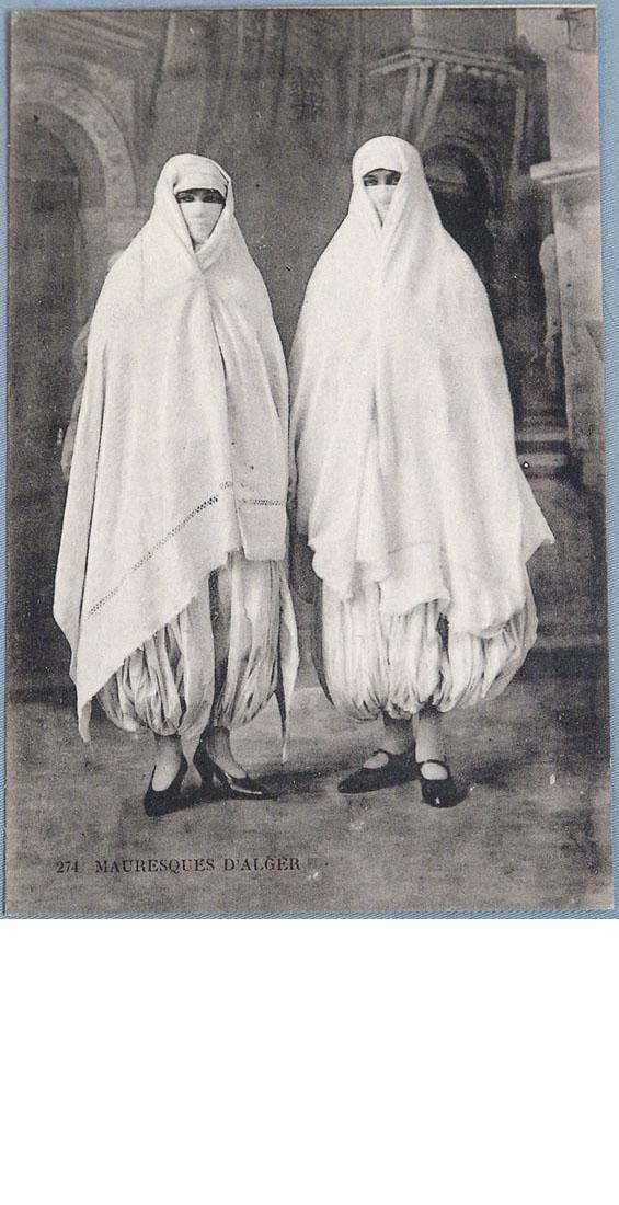 Old Photo Postcard of Veiled Moorish Women in Burkas: This is an old real photo postcard of two Moorish women wearing ethnic costumes (burkas?). "Mauresques d'Alger" (Moorish in Algiers) printed at the bottom. 3 1/2" x 5 1/2".