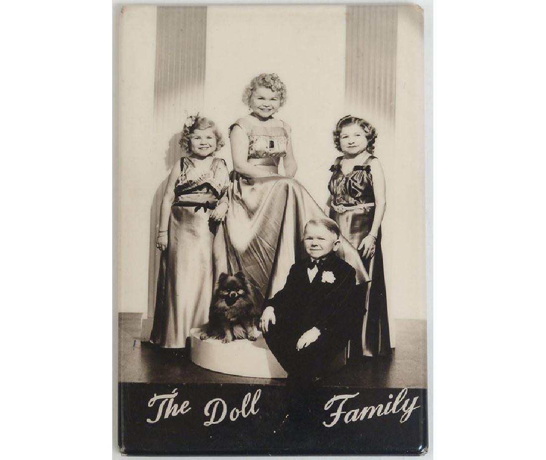 Old Metal Pocket Mirror - The Doll Family: This is an old metal celluloid pocket mirror featuring a photo of the Doll Family. 2" x 3" .