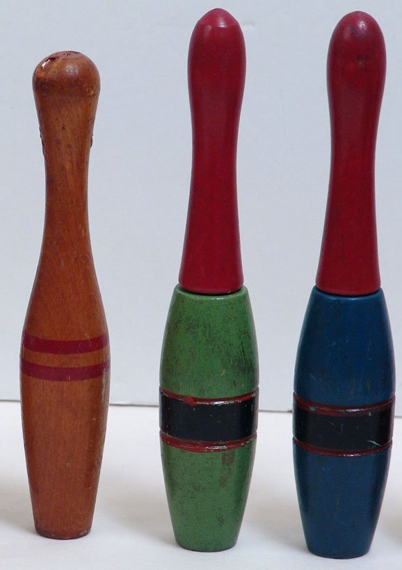 Antique Primitive Miniature Bowling Pins: This is a lot of three hand-painted antique folk art miniature children's or carnival bowling pins. Maybe used at a carnival, fair, or circus. The largest is 8" tall.