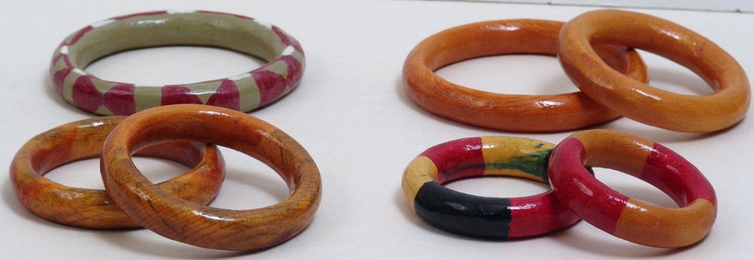 Antique Ring Toss Rings: This is a lot of seven hand-painted antique folk art/primitive ring toss rings, probably used at a carnival, fair, or circus. The largest is 5 1/4" in diameter.