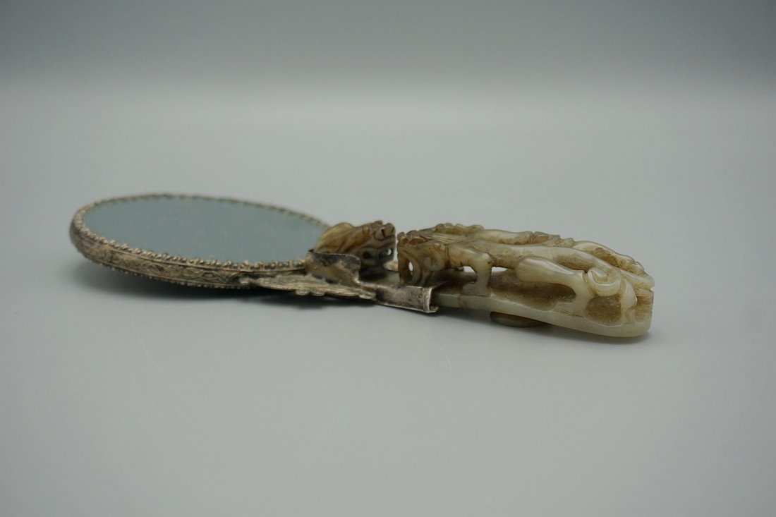 Antique chinese jade belt hook on copper mirror (1 of 10)