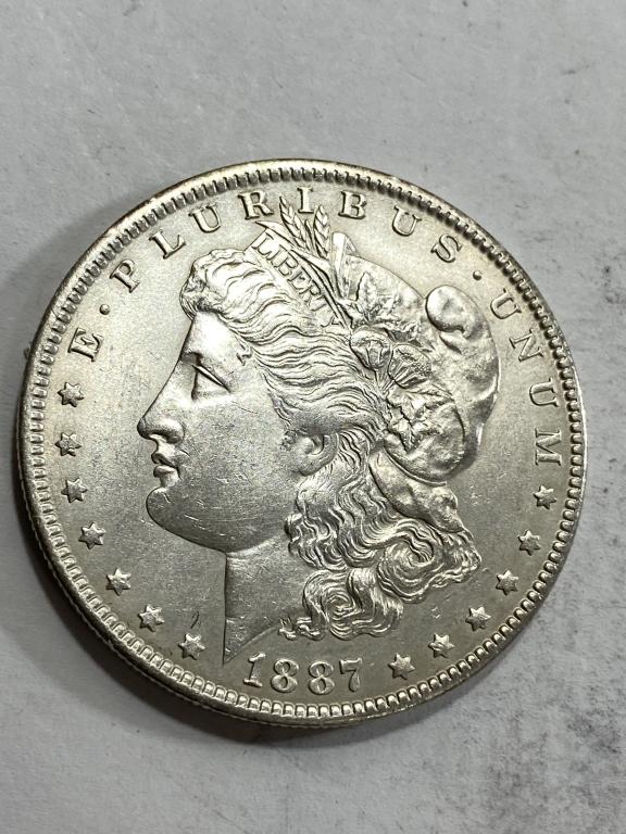 1887 O Better Sate in Grade BU Morgan Silver $1 (1 of 2)