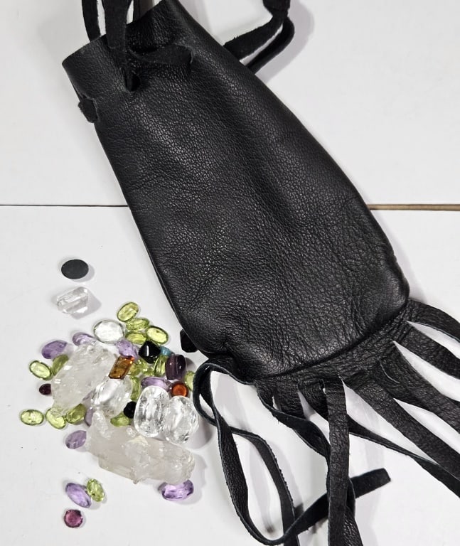 80.25 cts. Natural Gem and Crystal in Leather Bag: Item is the exact item in the image - Bidder is responsible for all value and grade determination - Please review all terms prior to placing any bids - All bids are an agreement to all terms - No exce