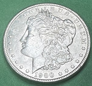 1900 O Au Plus Morgan Silver Dollar