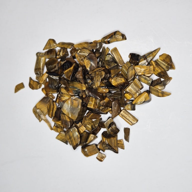 105 tcw. Natural Tiger Eye Tumbled Chips: Item is the exact item in the image - Bidder is responsible for all value and grade determination -