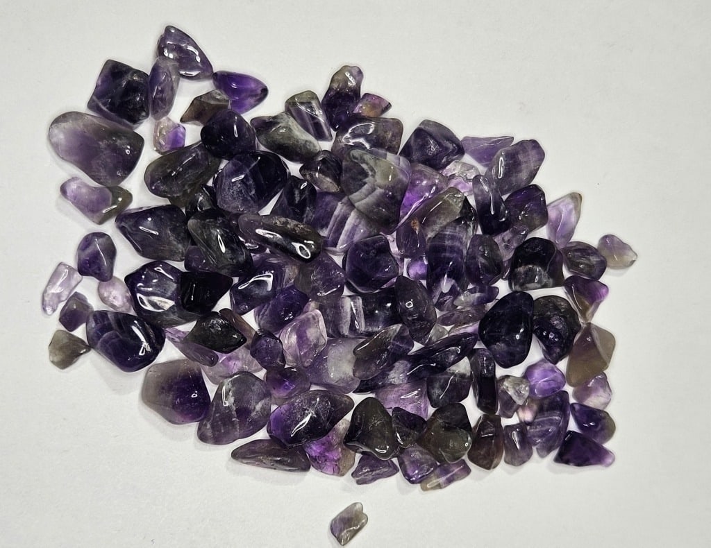 28.74 gram Natural Tumbled Amethyst Chip Lot: Item is the item in the image - Bidder is responsible for all value and grade determination - Please review all terms and conditions prior to placing any bids- All bids are an agreement to all terms-