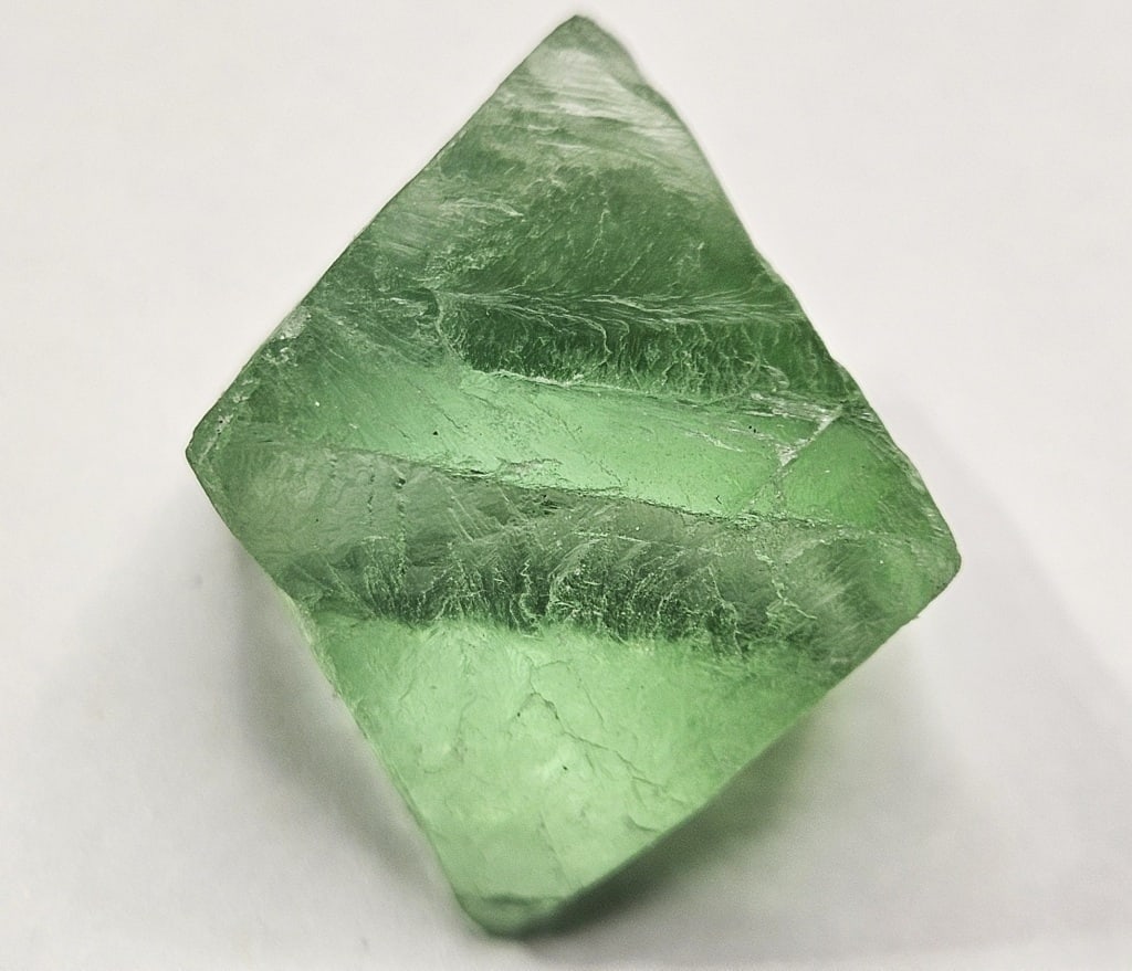 18.12 gram Gem Grade Green Flourite Octahedron: Item is the item in the image - Bidder is responsible for all value and grade determination - Please review all terms and conditions prior to placing any bids- All bids are an agreement toallterms-