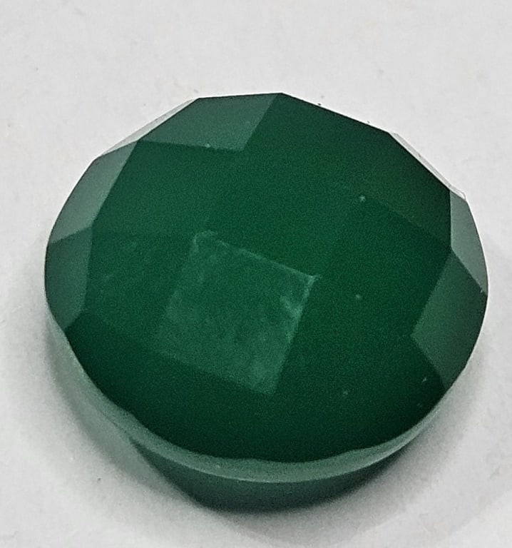 6.15 ct. Faceted Flourite Gemstone: Item is the exact item in the image- Bidder is responsible for all value and grade determination -