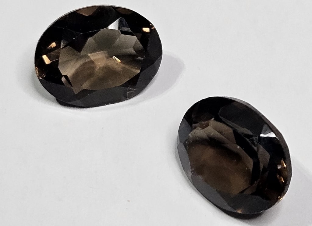 4.95 tcw. Matched Pair of Smoky Quartz Gemstones: Item is the exact item in the image - Bidder is responsible for all value and grad determination - Please review all terms prior to plaicng any bids- All sales fianl and all bids are an agreement