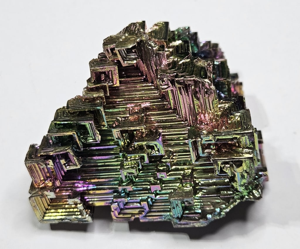 83 grams Bismuth Crystal Structure: Item is the exact item in the image - Bidder is responsible for all value grade determination - Please review all terms and conditins prior to placing any bids- All sales are final and all