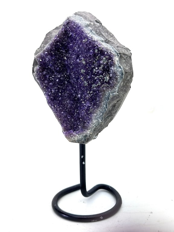 Exceptional Amethyst Cluster on Stand: Amethyst is a violet variety of quartz. Ancient Greeks wore amethyst and carved drinking vessels from it in the belief that it would prevent intoxication. Amethyst, a semiprecious stone, is often