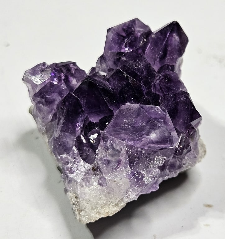 22.61 gram Gem Grade Natural Amethyst Cluster: Item is the exact item in the image - Bidder is responsible for all value grade determination - Please review all terms and conditins prior to placing any bids- All sales are final and all invoices du