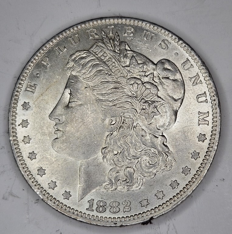 1882 o BU Morgan Dollar: Item is the exact item in the image - Bidder is responsible for all value and grade determination - Please review the images and complete terms prior to placing any bids.