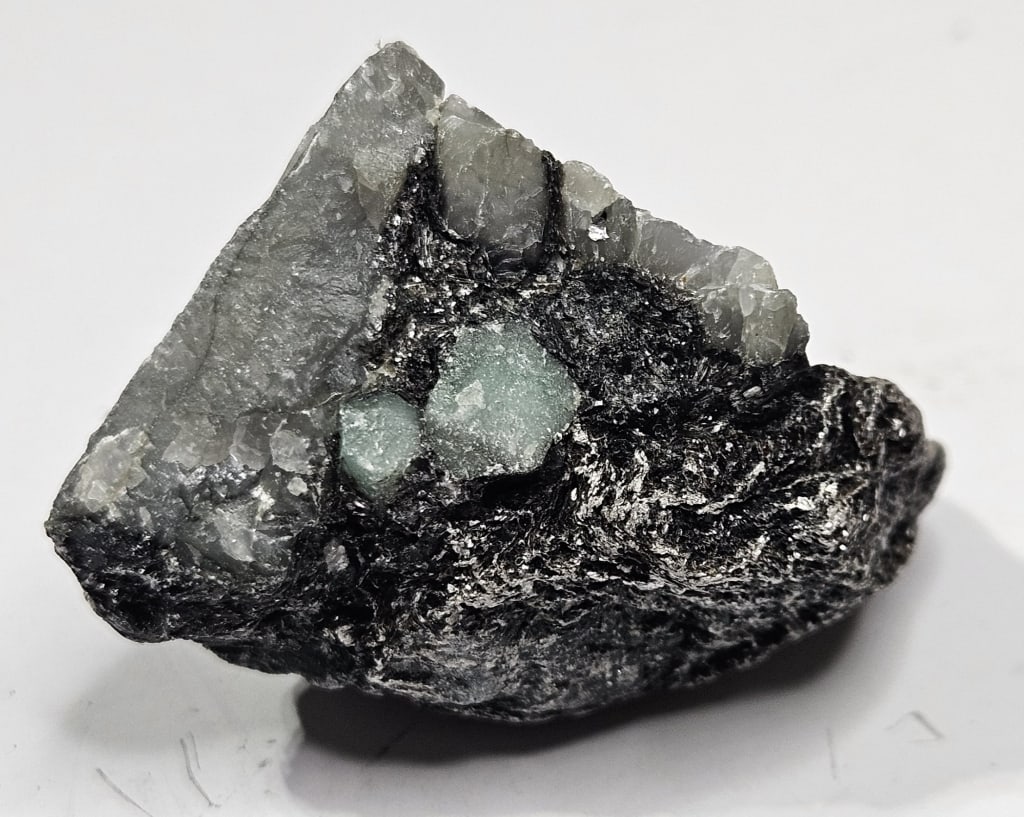 27.68 gram Natural Rough Emerlad Specimen: Item is the exact item in the image - Bidder is responsible for all value grade determination - Please review all terms and conditions prior to placing any bids- All sales are final and all