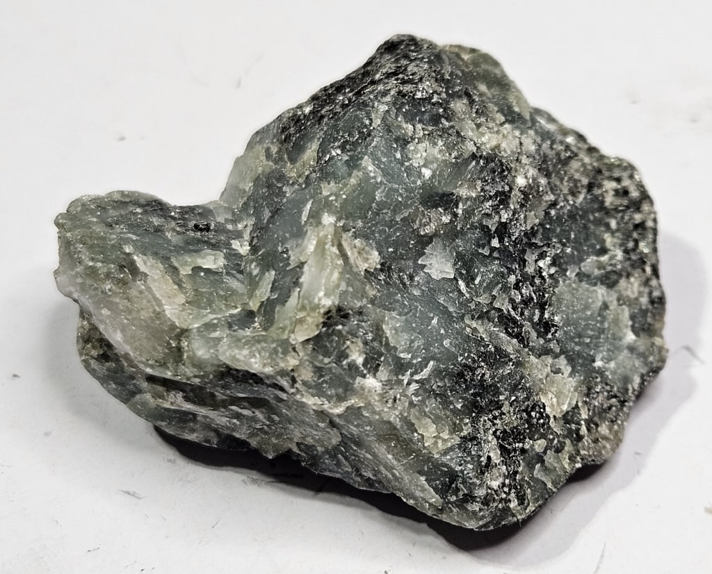 23.51 gram Natural Rough Emerlad Specimen: Item is the exact item in the image - Bidder is responsible for all value grade determination - Please review all terms and conditions prior to placing any bids- All sales are final and all