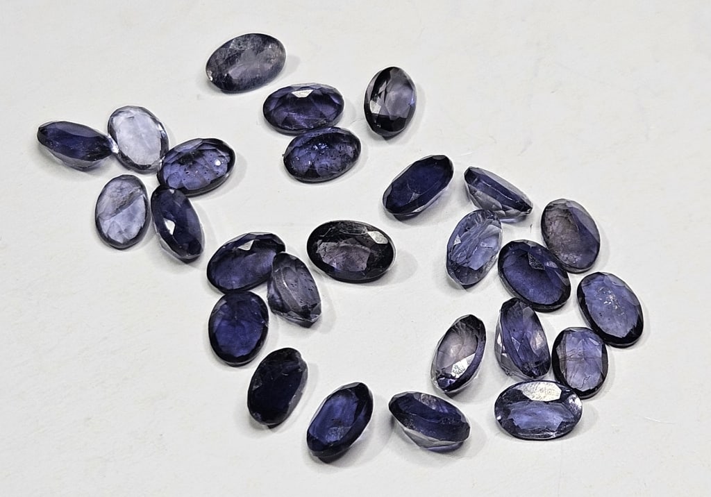 10.40 tcw.Iolite and Sapphire Gem Parcel: Items are as described in the tile - Please use the image to verify the item - Please review the entire terms and conditions prior to placing any bids- All sales final -