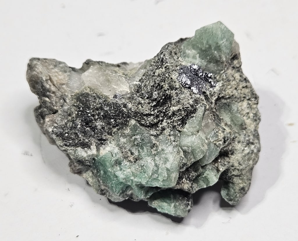 25 gram Natural Rough Emerald Specimen: Item is the exact item in the image - Bidder is responsible for all value grade determination - Please review all terms and conditions prior to placing any bids- All sales are final and all