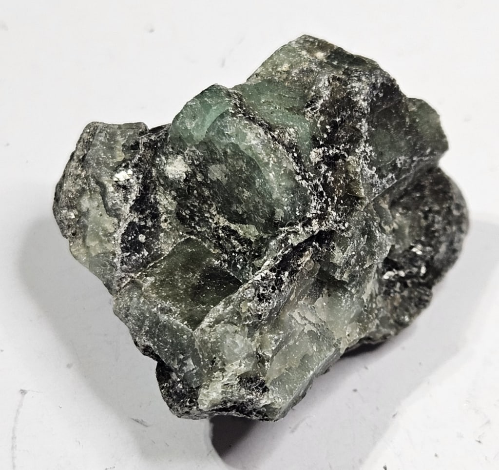 21.51 gram Natural Rough Emerald Specimen: Item is the exact item in the image - Bidder is responsible for all value grade determination - Please review all terms and conditions prior to placing any bids- All sales are final and all