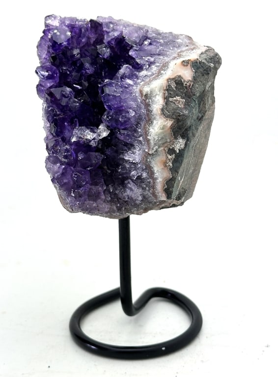 Exceptional Amethyst Cluster on Stand: Amethyst is a violet variety of quartz. Ancient Greeks wore amethyst and carved drinking vessels from it in the belief that it would prevent intoxication. Amethyst, a semiprecious stone, is often used