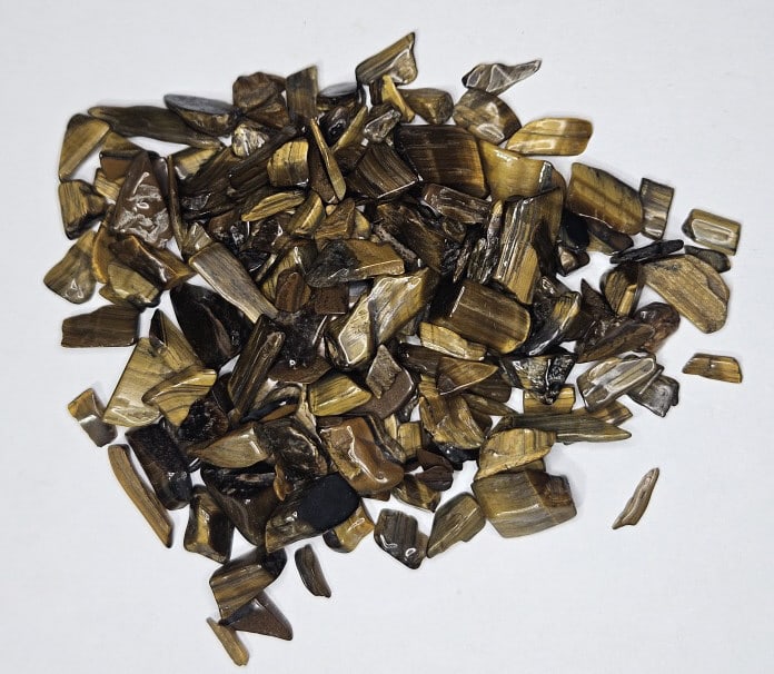 27.18 gram Natural Tiger Eye Chip Parcel: Item is the item in the image - Bidder is responsible for all value and grade determination - Please review all terms and conditions prior to placing any bids- All 