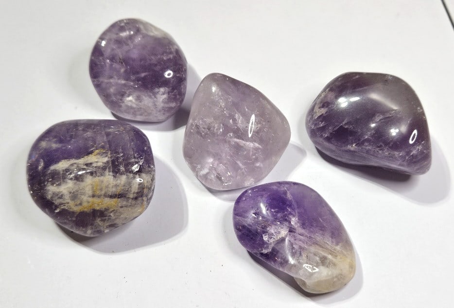 Lot of (5) Natural Tumbled Amethyst Stones: Item is the exact item in the image- Bidder is responsible for all value and grade determination -