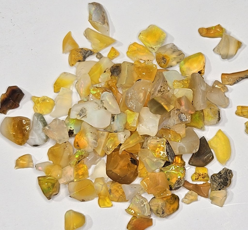 52.30 tcw. Natural Rough Opal Parcel: Item is the exact item in image - Bidder is responsible for all value and grade determination - Please review all terms prior to placing any bids- Any bid is an agreement to all terms and