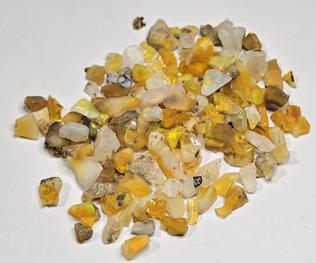 70.45 tcw. Natural Rough Opal Parcel: Item is the exact item in image - Bidder is responsible for all value and grade determination - Please review all terms prior to placing any bids- Any bid is an agreement to all terms and conditions -