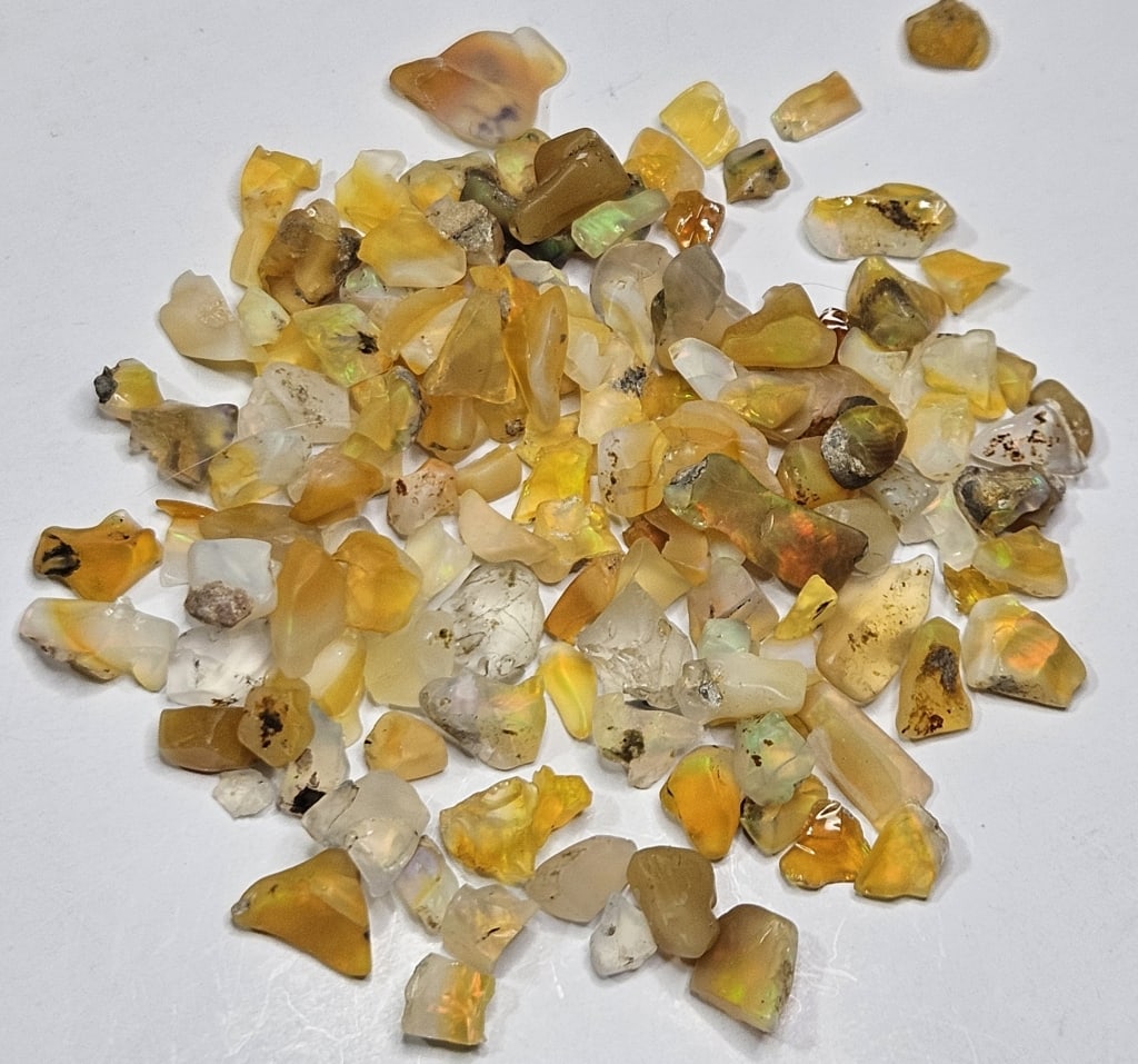 74.65 tcw. Natural Rough Opal Parcel: Item is the exact item in image - Bidder is responsible for all value and grade determination - Please review all terms prior to placing any bids- Any bid is an agreement to all terms and conditions -