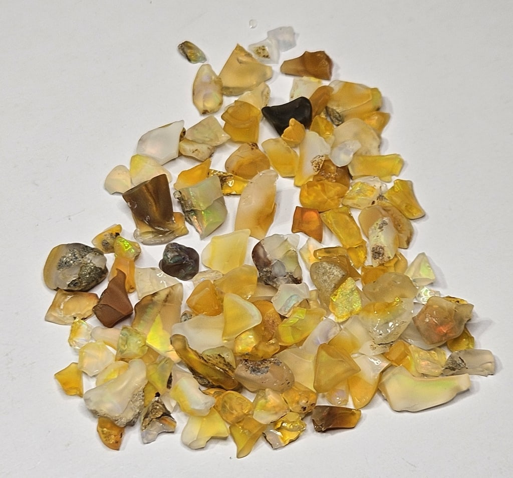 58.10 tcw. Natural Rough Opal Parcel: Item is the exact item in image - Bidder is responsible for all value and grade determination - Please review all terms prior to placing any bids- Any bid is an agreement to all terms and