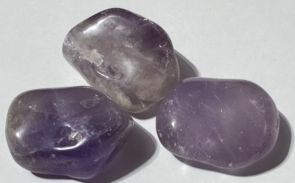 Lot of (3) Tumbled Natural Amethyst Stone: Items are the exact items in the image - Please review the entire terms and conditions prior to placing any bids - Any bid is an agreement to all terms and conditions -