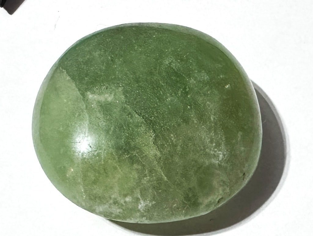 83.72 Gram Flourite Palm Stone: Item is the exact item in image - Bidder is responsible for all value and grade dtermination - Please review all terms and conditions