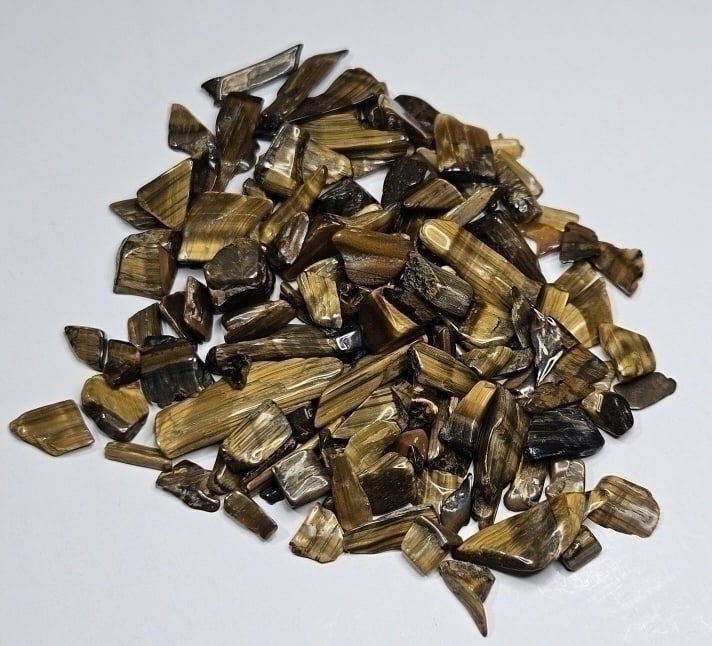 110.25 tcw. Natural Tiger Eye Tumble Chips: Item is the exact item in the image - Bidder is responsible for all value and grade determination -