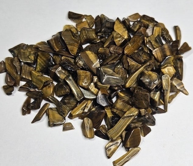23.05 gram Natural Tiger Eye Chip Lot: Item is the item in the image - Bidder is responsible for all value and grade determination - Please review all terms and conditions prior to placing any bids- All 